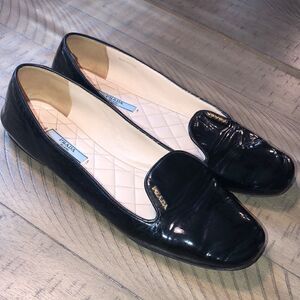 Prada Gold Logo Patent Leather Loafers Quilted Footbed. Sanitized and polished.